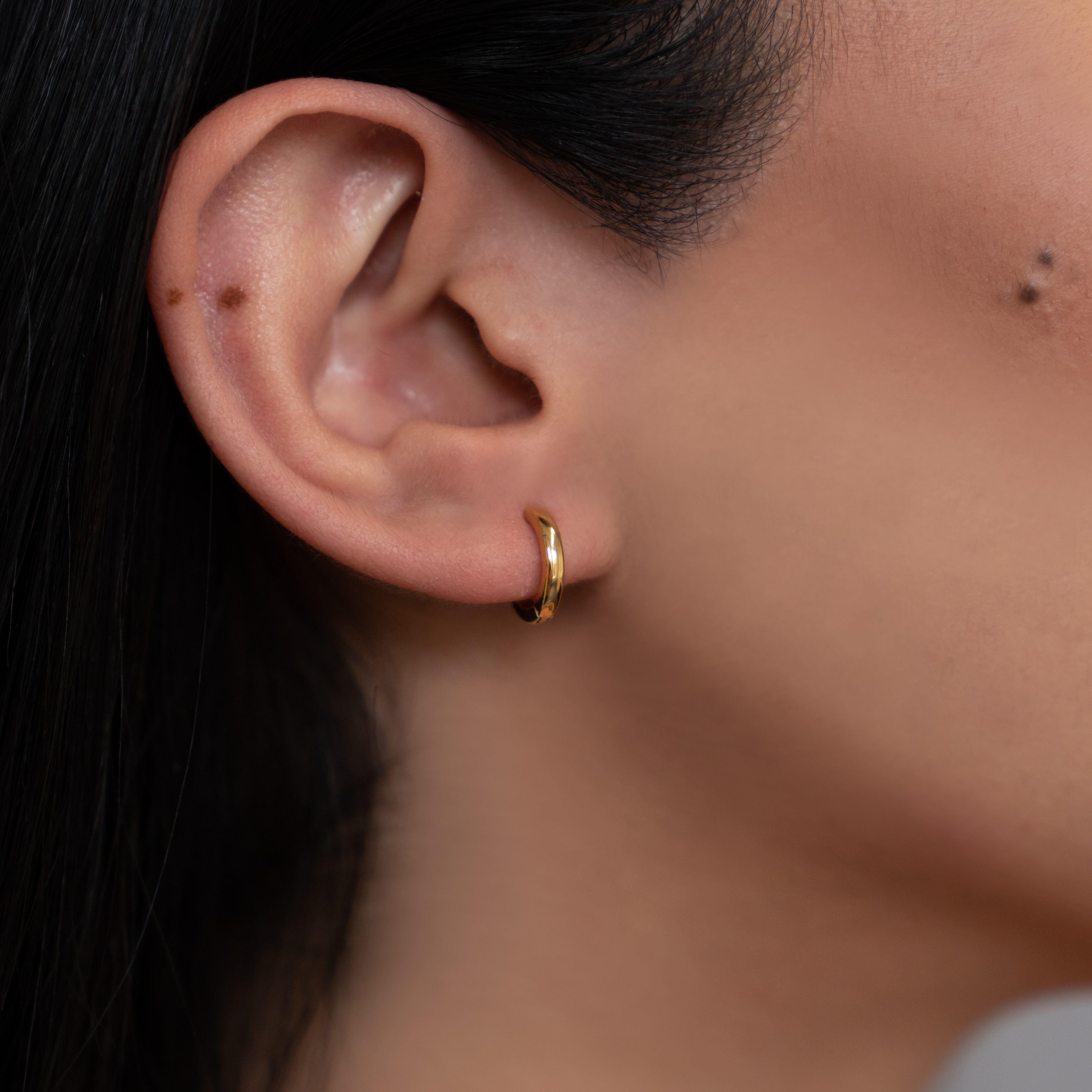 Gold ear hugging on sale hoops